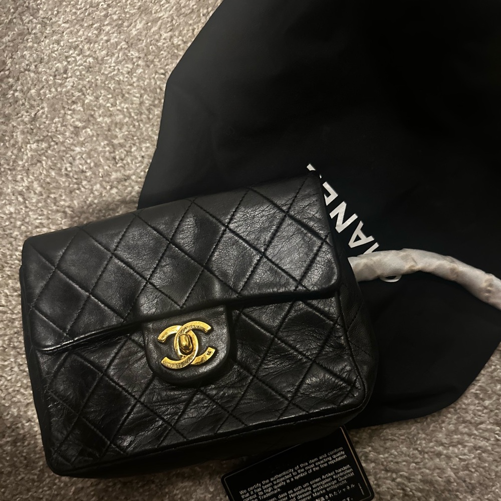 Vintage Chanel Black Quilted Crossbody Bag with Gold Accents.